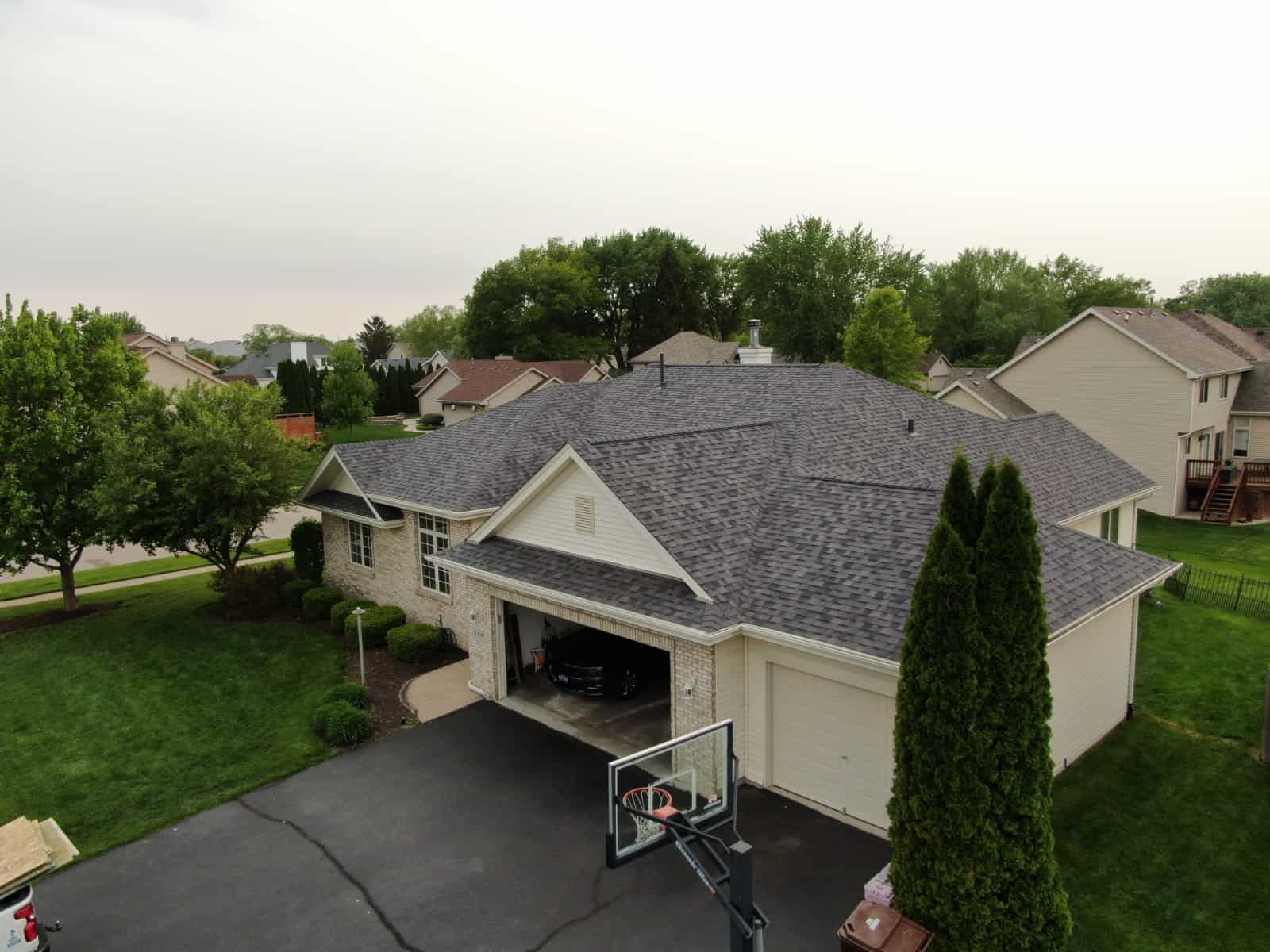 aerial angled view of house with new roof renovation.